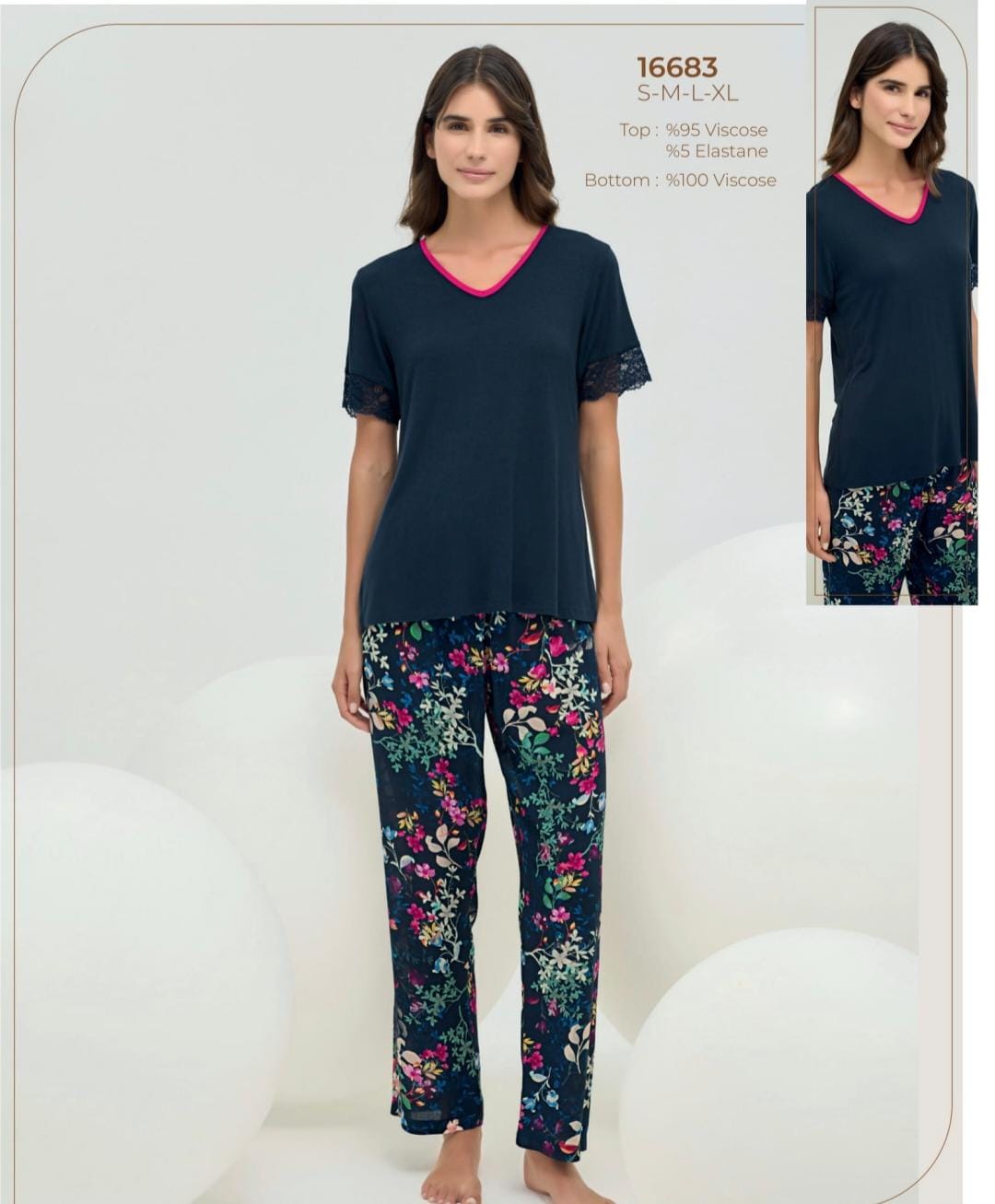 2-piece navy pyjama set - pajama set - summer pajama - women pajama -Woman wearing a navy pajama set with floral pants on a white background