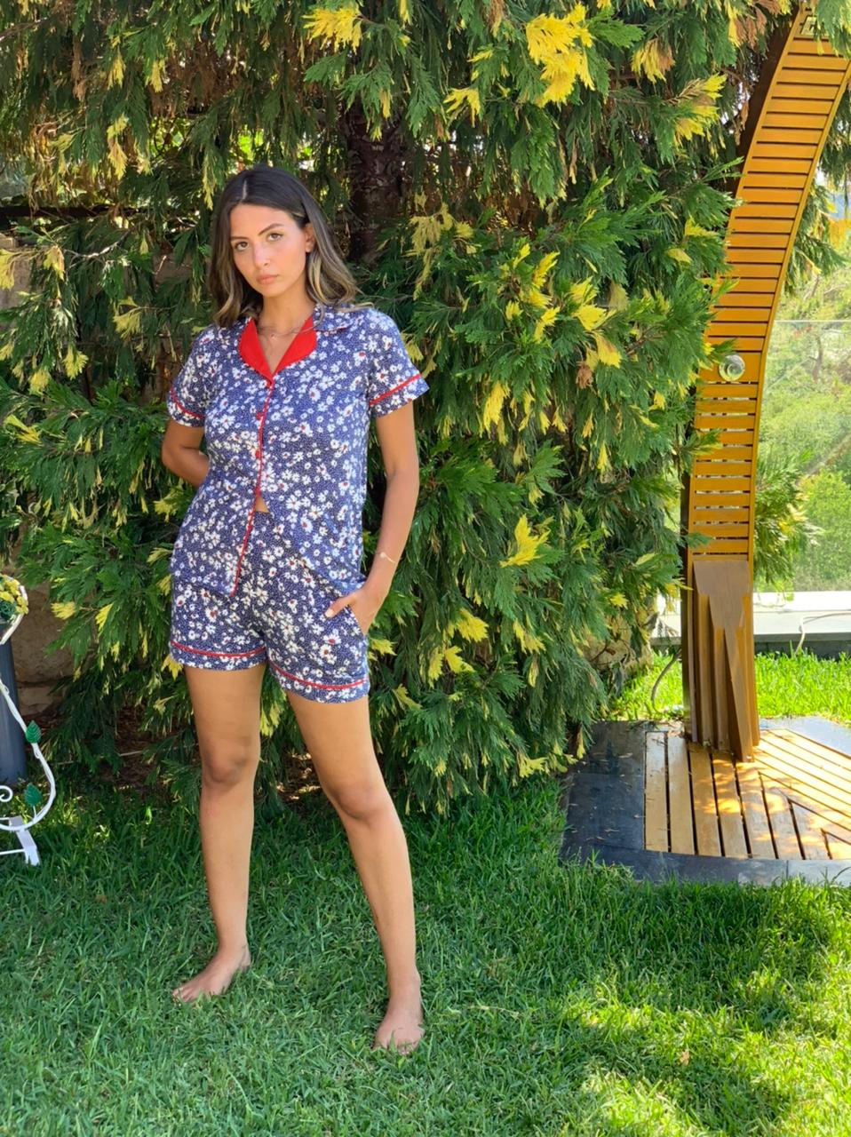 Woman posing in Popjammies Floral Pajama Set with hands in pockets.