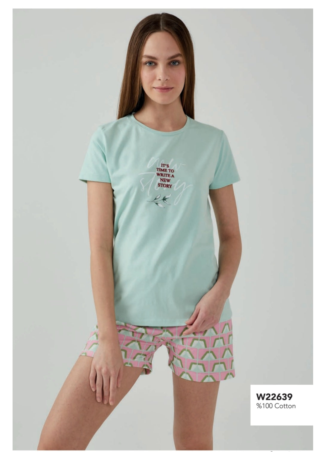 Model wearing Popjammies 'New Story' pyjama set with mint green top and geometric shorts.