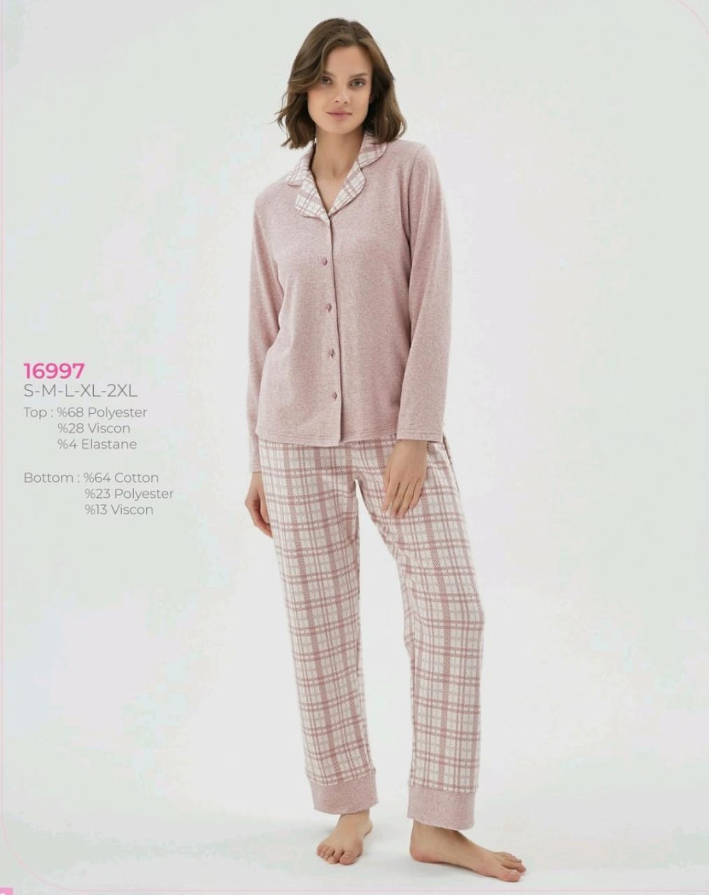 Woman wearing a pink pajama set with plaid pants on a white background