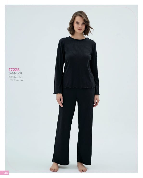 Woman wearing a black outfit on a white background