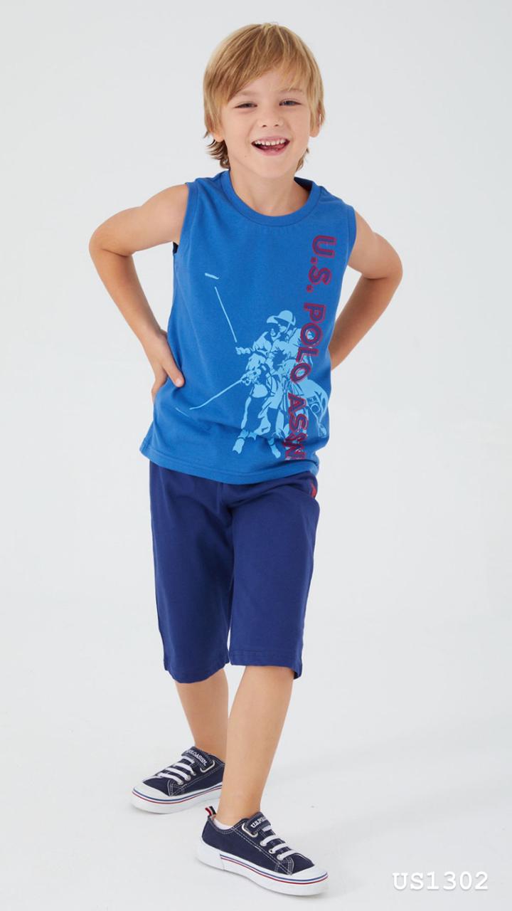 Boy wearing a sleeveless blue top with "U.S. Polo Assn." print and navy shorts from Popjammies.