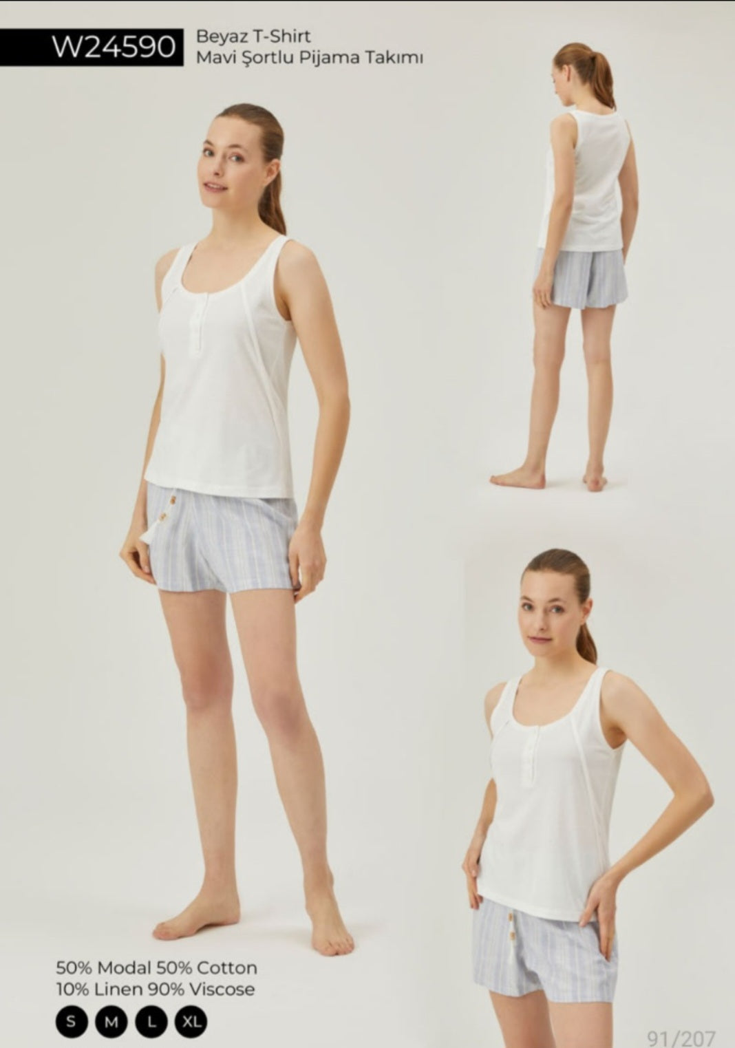 Woman wearing a white tank top and blue striped shorts pajama set