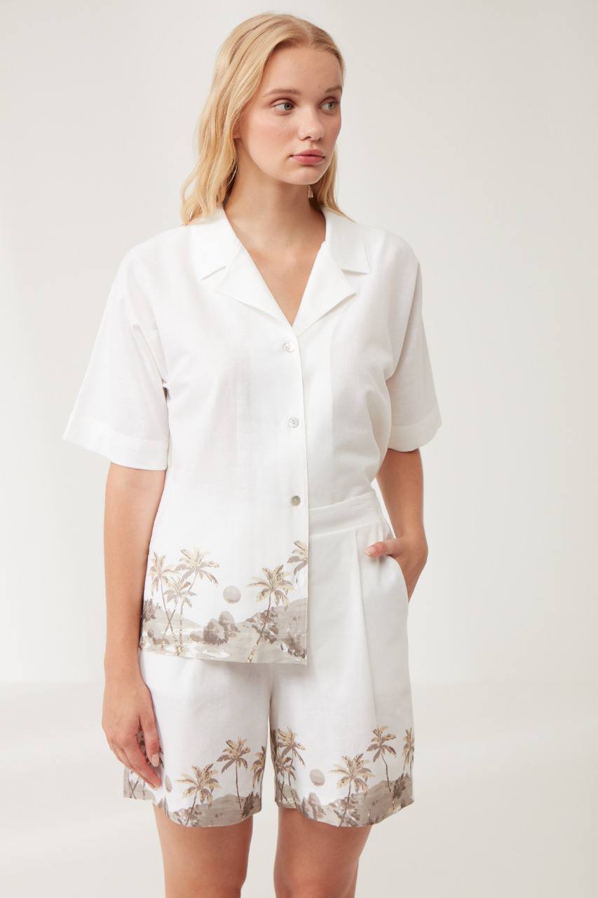 Woman wearing Popjammies White Palm Print Short Sleeve Pyjama Set.